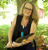 rachel with talking stick and feather